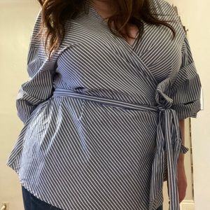 Dramatic ruffle sleeve wrap top